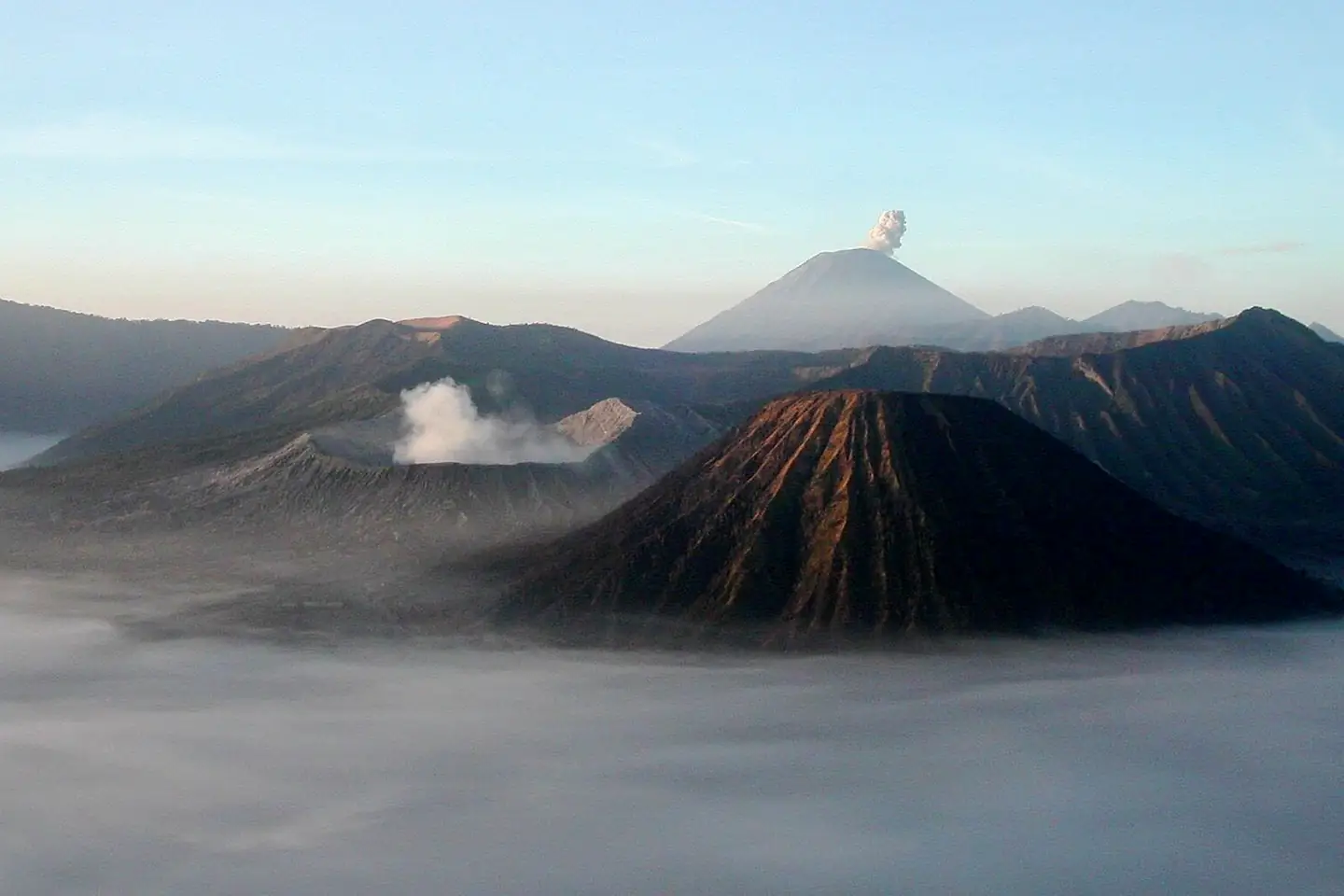 Mount Bromo at sunrise, showing its volcanoes and Mount Semeru (background) in Java's volcanoes, Indonesia