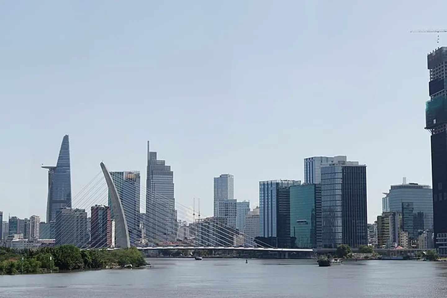 The modern Ho Chi Minh City skyline beside the Saigon River, Vietnam